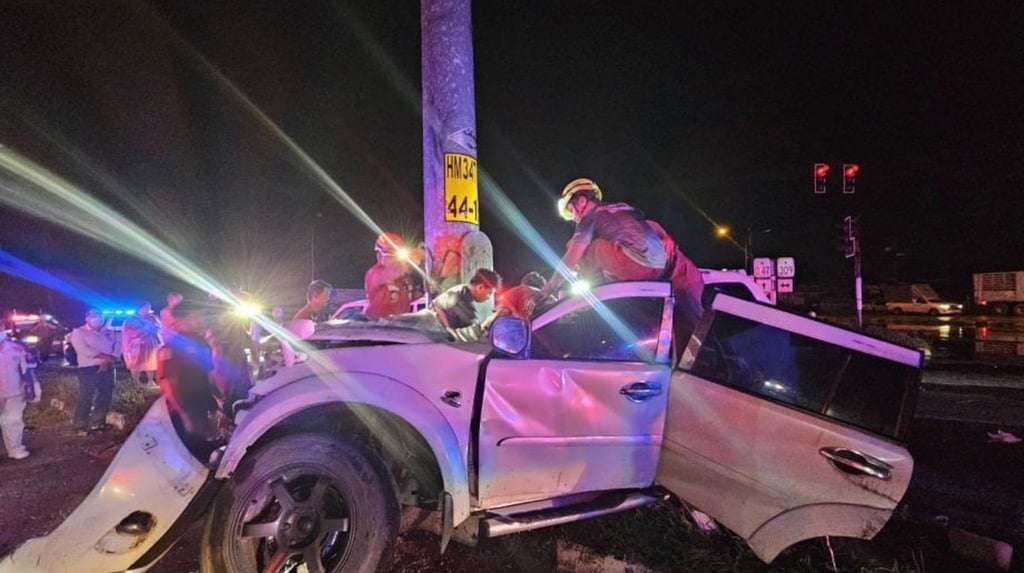 The driver’s white SUV was almost cut in half by the sheer impact of the crash. Photo: Handout The driver’s white SUV was almost cut in half by the sheer impact of the crash. Photo: Handout