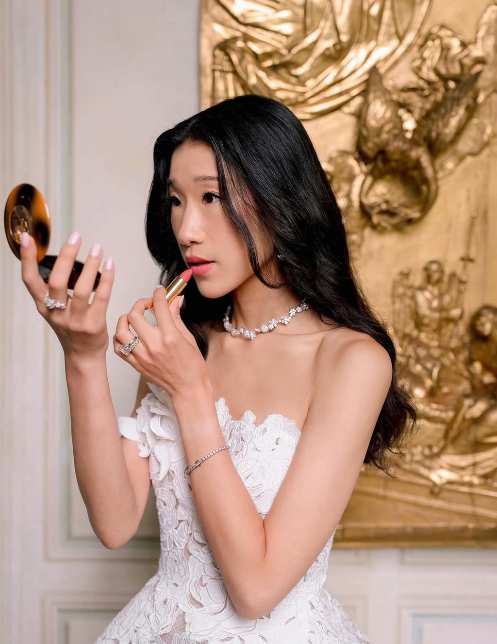 Becca Bloom applies Lancôme lipstick on her wedding day. Photo: @beccaxbloom/Instagram