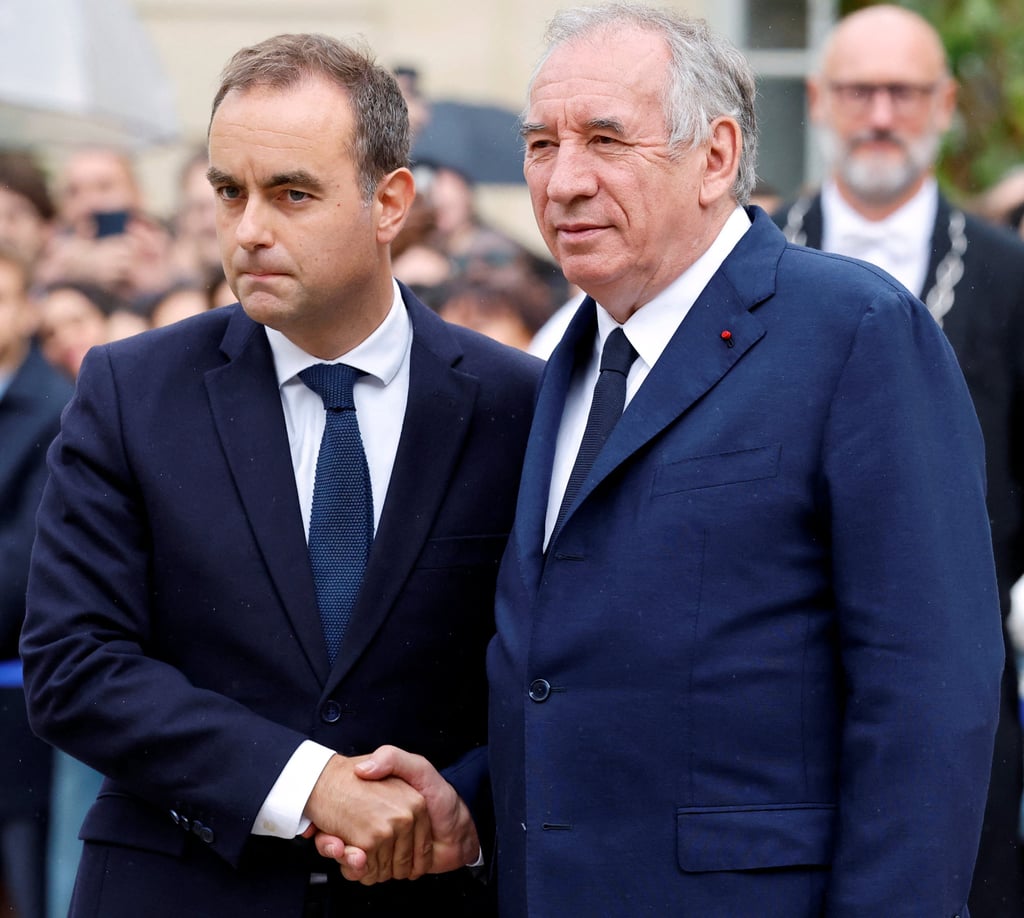 Sebastien Lecornu (left) shakes hands with Francois Bayrou as he arrives for the handover ceremony in Paris on Wednesday. Photo: Reuters Sebastien Lecornu (left) shakes hands with Francois Bayrou as he arrives for the handover ceremony in Paris on Wednesday. Photo: Reuters
