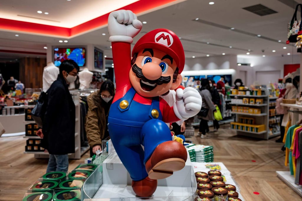 Mario jumps at a Nintendo store in Tokyo, Japan. Photo: AFP