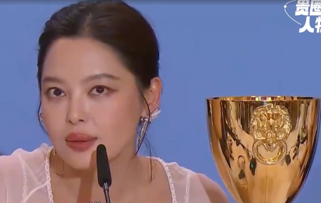 Xin Zhilei speaks to the media alongside the best actress award trophy she won at this year’s Venice Film Festival. Photo: Sina Xin Zhilei speaks to the media alongside the best actress award trophy she won at this year’s Venice Film Festival. Photo: Sina