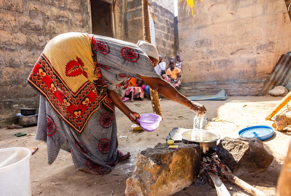 A woman in Vikindu village, Tanzania, mixes the ingredients for ugali, a traditional dish made with fortified flour. Photo: Handout