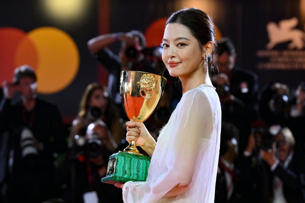 Chinese actress Xin Zhilei holds the Volpi Cup for best actress for her performance in The Sun Rises on Us All at the 82nd Venice International Film Festival. Photo: EPA