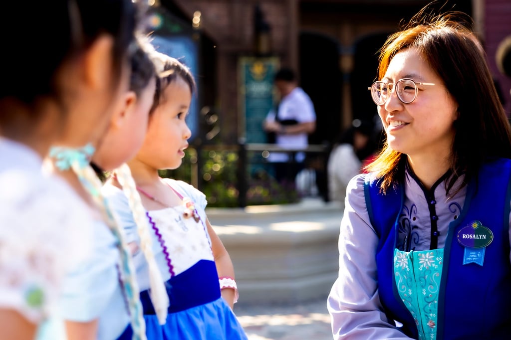 Hong Kong Disneyland executive Rosalyn Woo (right), who was part of Hong Kong Disneyland’s opening team, chats with a group of young guests at the resort. Hong Kong Disneyland executive Rosalyn Woo (right), who was part of Hong Kong Disneyland’s opening team, chats with a group of young guests at the resort.