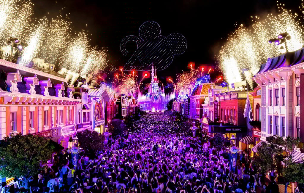 Guests fill Hong Kong Disneyland’s Main Street, USA as they enjoy the resort’s upgraded 20th anniversary nighttime spectacular, Momentous: Party in the Night Sky.