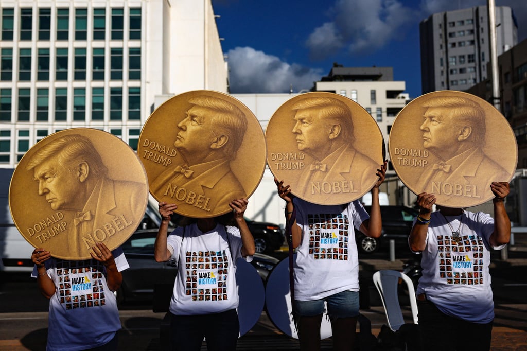 Protesters in Tel Aviv, Israel, hold signs depicting Donald Trump as they call for an end to the Gaza war and the release of all hostages. Photo: Reuters