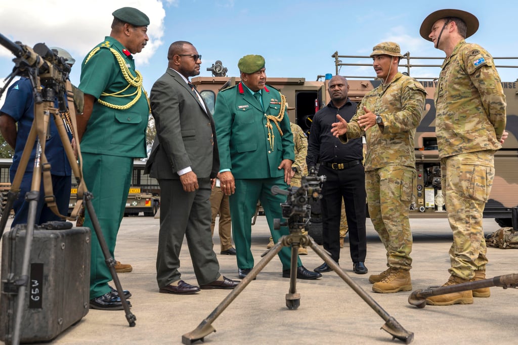 Australian soldiers talk to Papua New Guineas defence minister and other officials during a visit to Brisbane earlier this year. Photo: Australian Defence Force/AFP