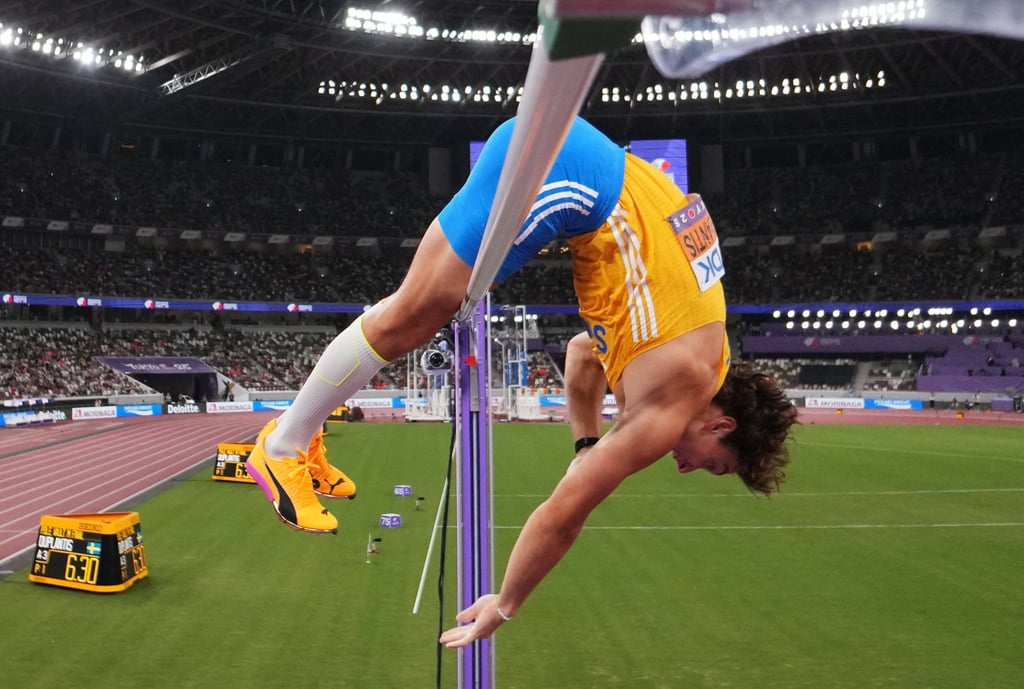 Armand Duplantis clears the bar to break the world record in Tokyo on Monday. Photo: Reuters