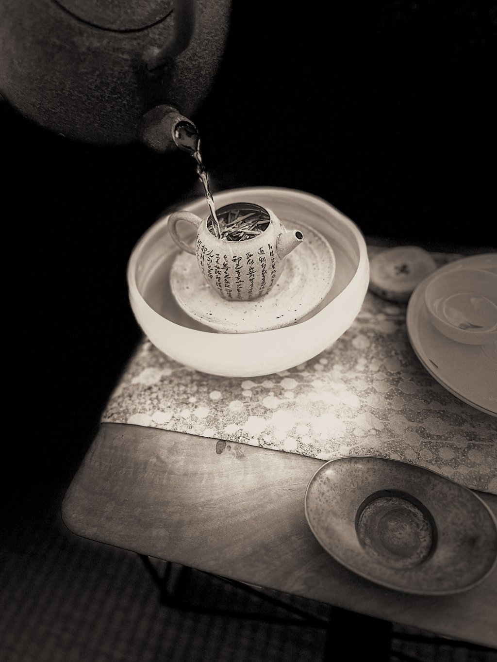 Jason Cohen brews tea in a teapot with the Heart Sutra carved into it. Photo: courtesy Jason Cohen