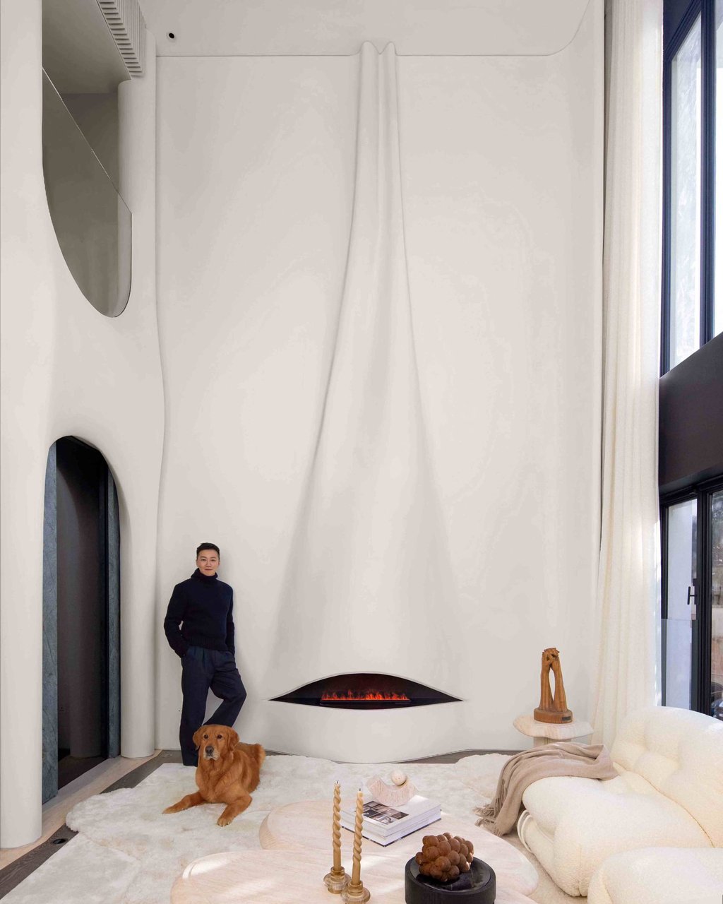 Nelson Chow, of NC Design and Architecture, stands beside the curtain-like double-height wall he designed in the living area. Photo: Harold de Puymorin Nelson Chow, of NC Design and Architecture, stands beside the curtain-like double-height wall he designed in the living area. Photo: Harold de Puymorin