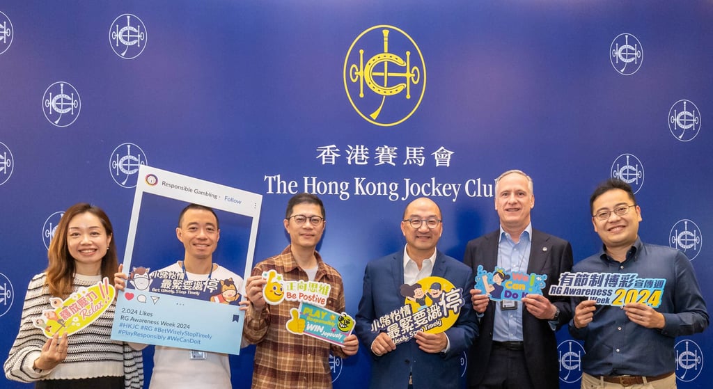 The Hong Kong Jockey Club’s Raymond Tam (third right), executive director, corporate affairs, Moray Taylor-Smith (second right), executive director, security, integrity and information security, and Freely Cheng (third left), head of external affairs, at an event marking the Club’s Responsible Gambling Awareness Week.