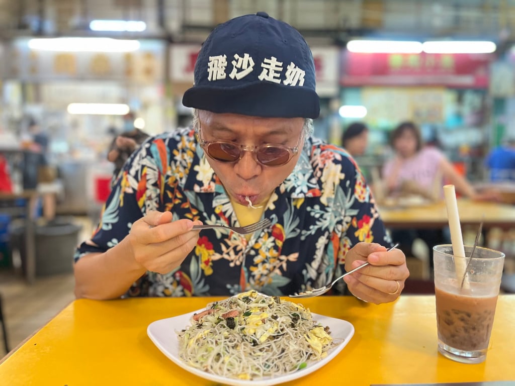 Wong enjoys a dish at Lok Yuen, in the Kowloon City Market and Cooked Food Centre. Photo: Kylie Knott Wong enjoys a dish at Lok Yuen, in the Kowloon City Market and Cooked Food Centre. Photo: Kylie Knott