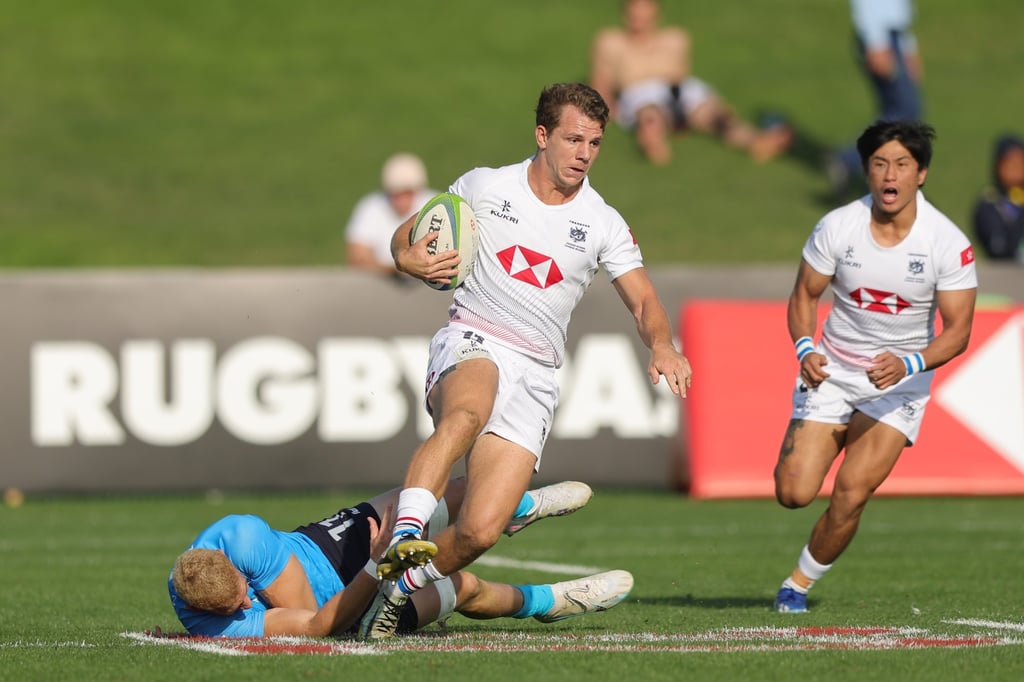 Seb Brien tries to dodge a Uruguayan tackler during last year’s Challenger Series. Photo: World Rugby
