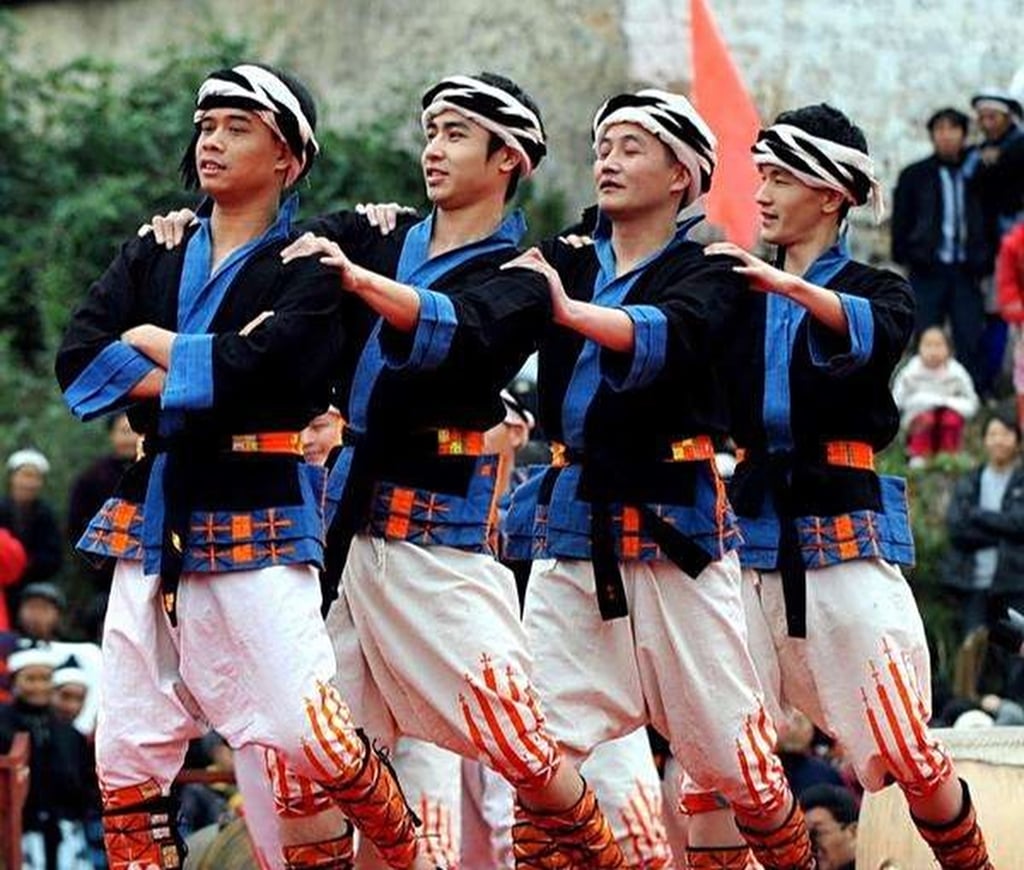 Men don white trousers that fall just below the knee, embellished with five red patterns that pay tribute to the ancient Yao king, who famously bled from a knee wound during battle. Photo: Handout