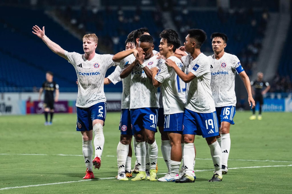 Calum Hall (far left) leads the celebrations after Gil Martins’ equaliser for Eastern against Gamba Osaka. Photo: Eastern