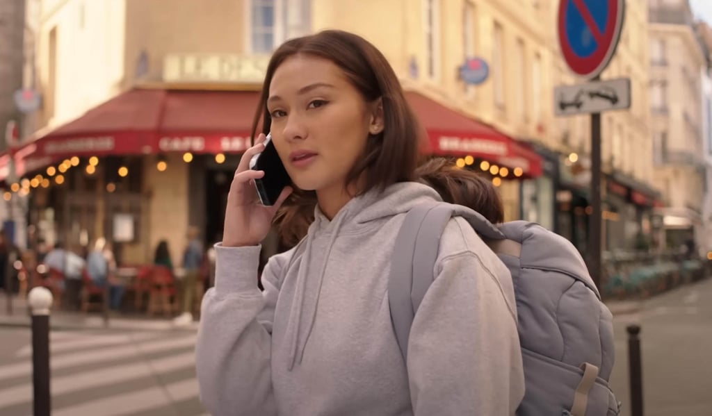 Belly passes two Parisian cafes in an episode of The Summer I Turned Pretty. Photo: @primevideo/YouTube