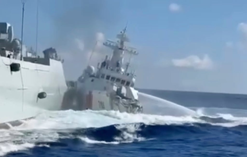 A damaged Chinese coastguard ship (right) is seen beside a Chinese naval vessel after they collided near Scarborough Shoal on August 11. Photo: Philippine Coast Guard/AP