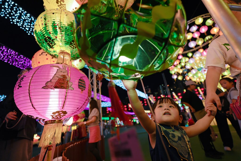 Kids admire the lanterns at Victoria Park in Causeway Bay. Photo: Eugene Lee