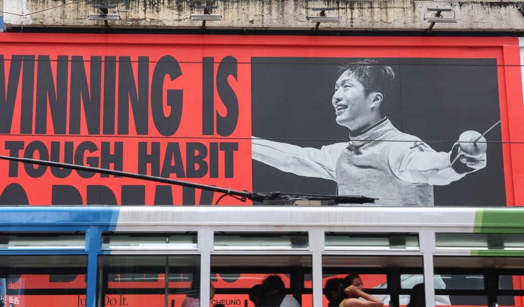 Hong Kong fencer and Olympic gold medalists Cheung Ka-long is seen on billboard in Causeway Bay. Photo: Dickson Lee