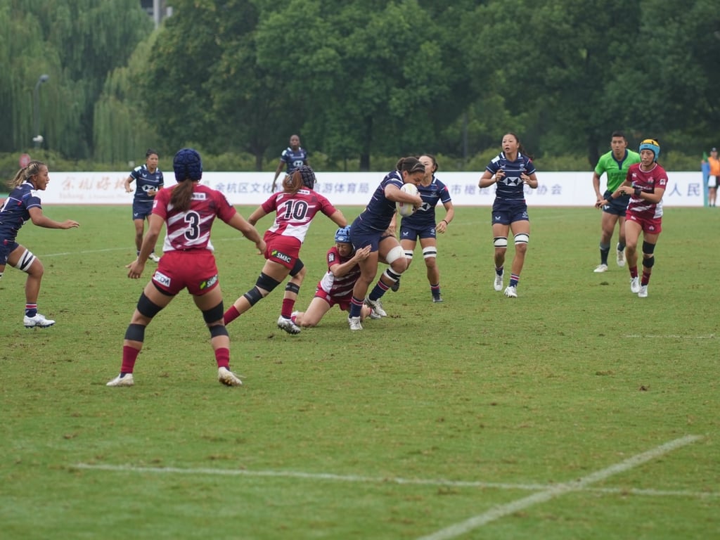 Natasha Olson-Thorne carries the ball for Hong Kong in the semi-final against Japan. Photo: HKCR