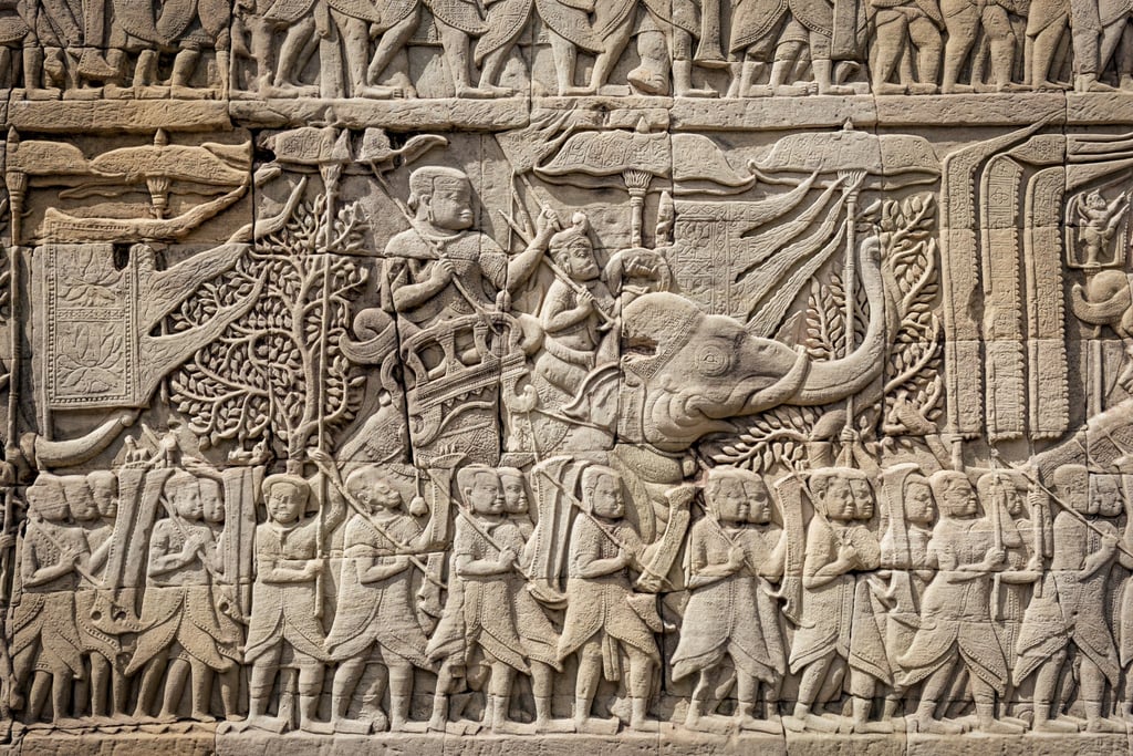 The Bayon Temple stands in the heart of Angkor Thom, the carved bas-reliefs on the outer walls depicting heroic tales and scenes of everyday Khmer folk. Photo: Getty Images