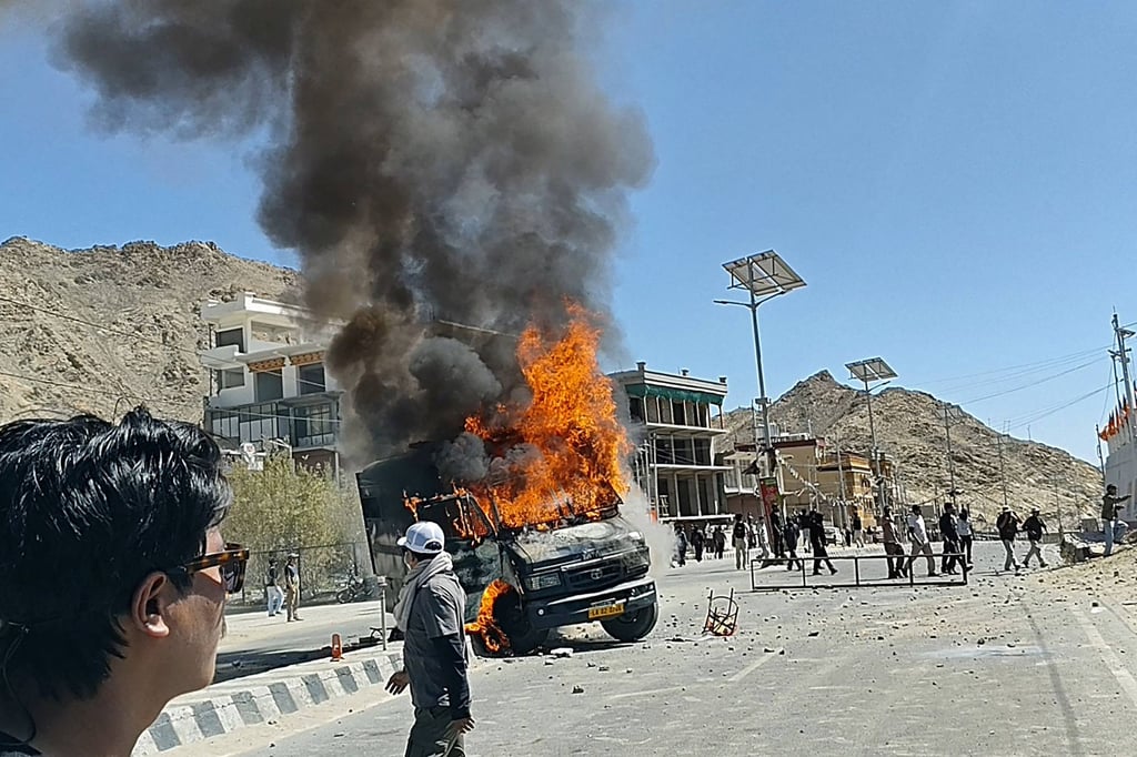 A police vehicle torched by the demonstrators on Wednesday. Photo: AFP