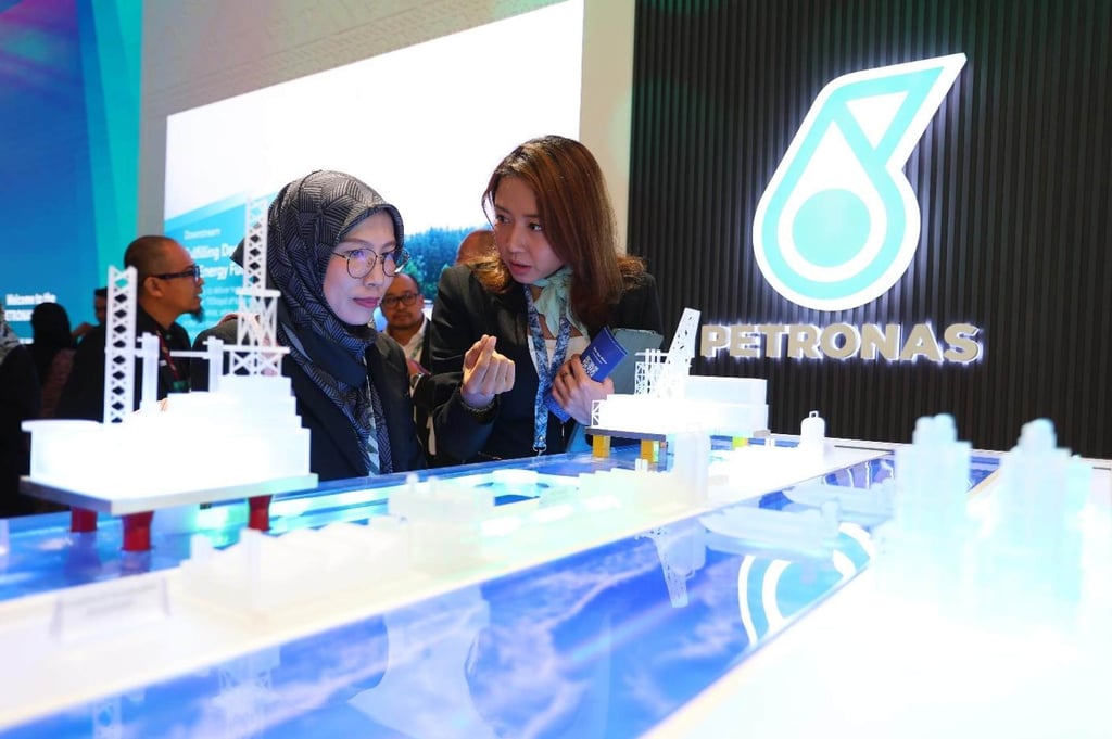 An exhibitor at Energy Park outlines key aspects of her business operations to a visitor during the Energy Asia 2025 forum. Photo: Energy Asia An exhibitor at Energy Park outlines key aspects of her business operations to a visitor during the Energy Asia 2025 forum. Photo: Energy Asia