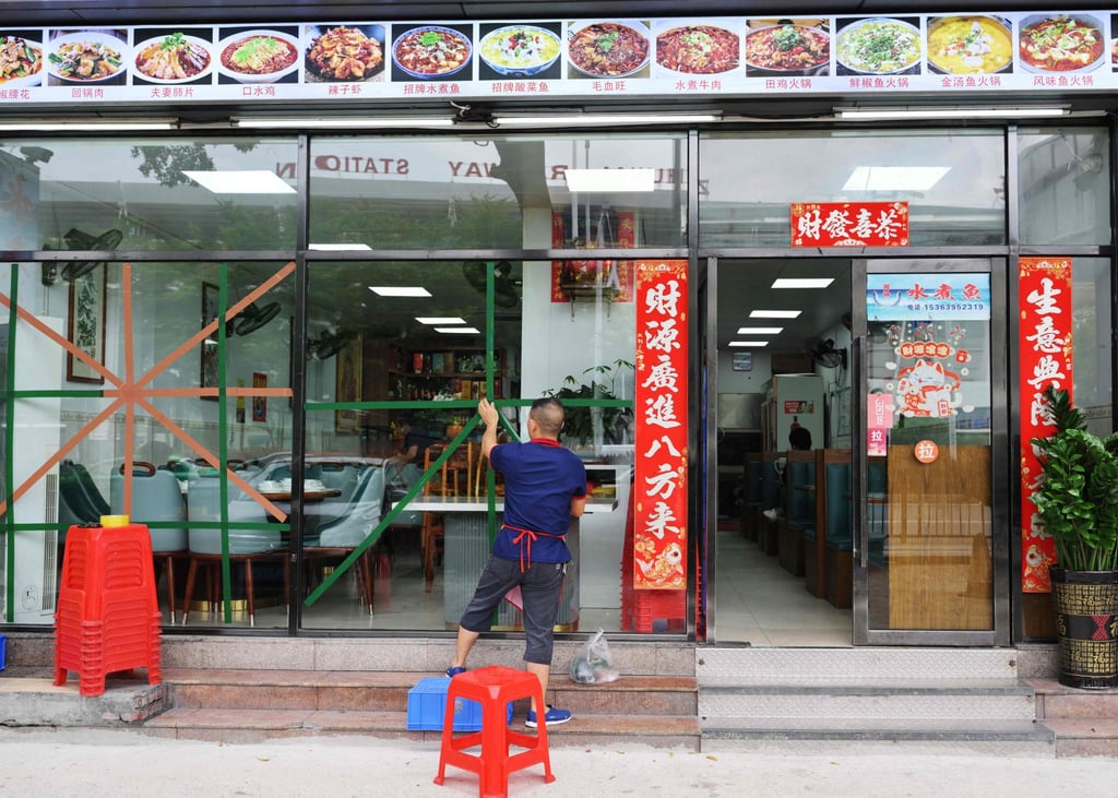 In Zhuhai, Guangdong province, windows are taped ahead of the typhoon making landfall. Schools and businesses have been closed in at least 10 cities, affecting tens of millions of people. Photo: AFP