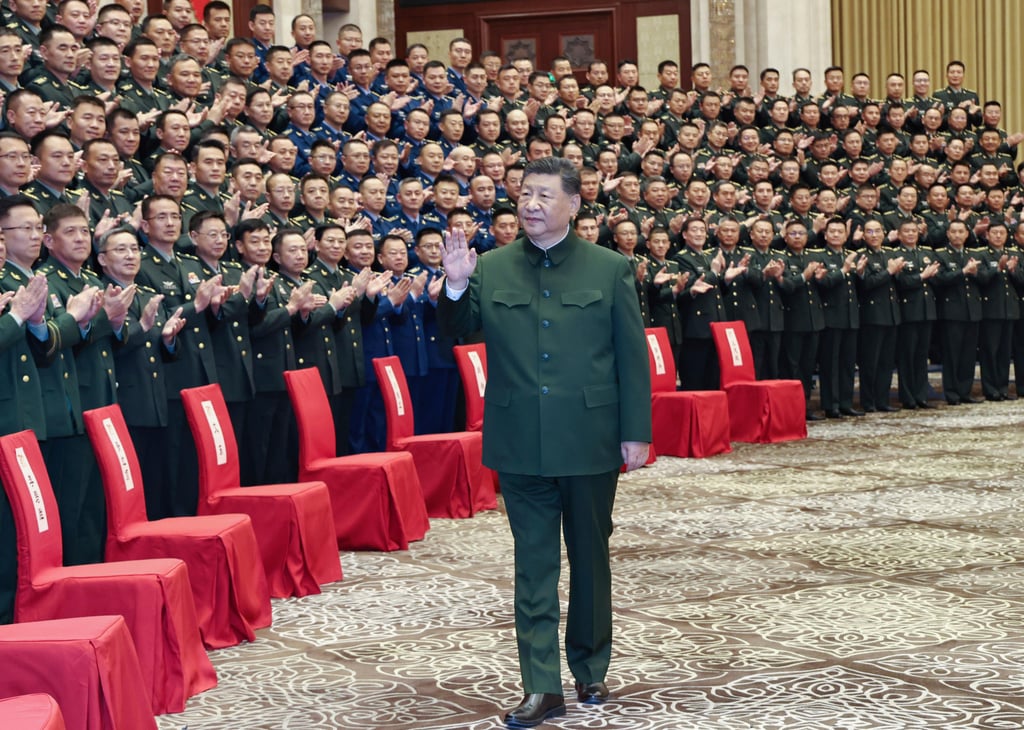 Xi meets with representatives of military personnel stationed in Urumqi in Xinjiang on Tuesday. Photo: Xinhua via AP