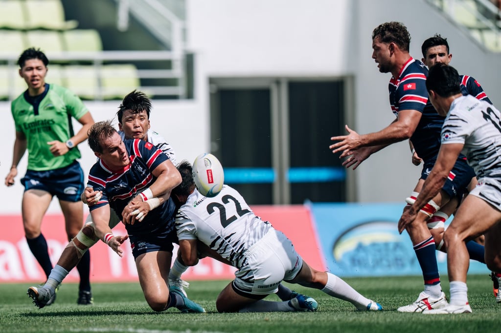 Tom Hill (left) offloads to Josh Hrstich against South Korea in Incheon in July. Photo: HKCR Tom Hill (left) offloads to Josh Hrstich against South Korea in Incheon in July. Photo: HKCR