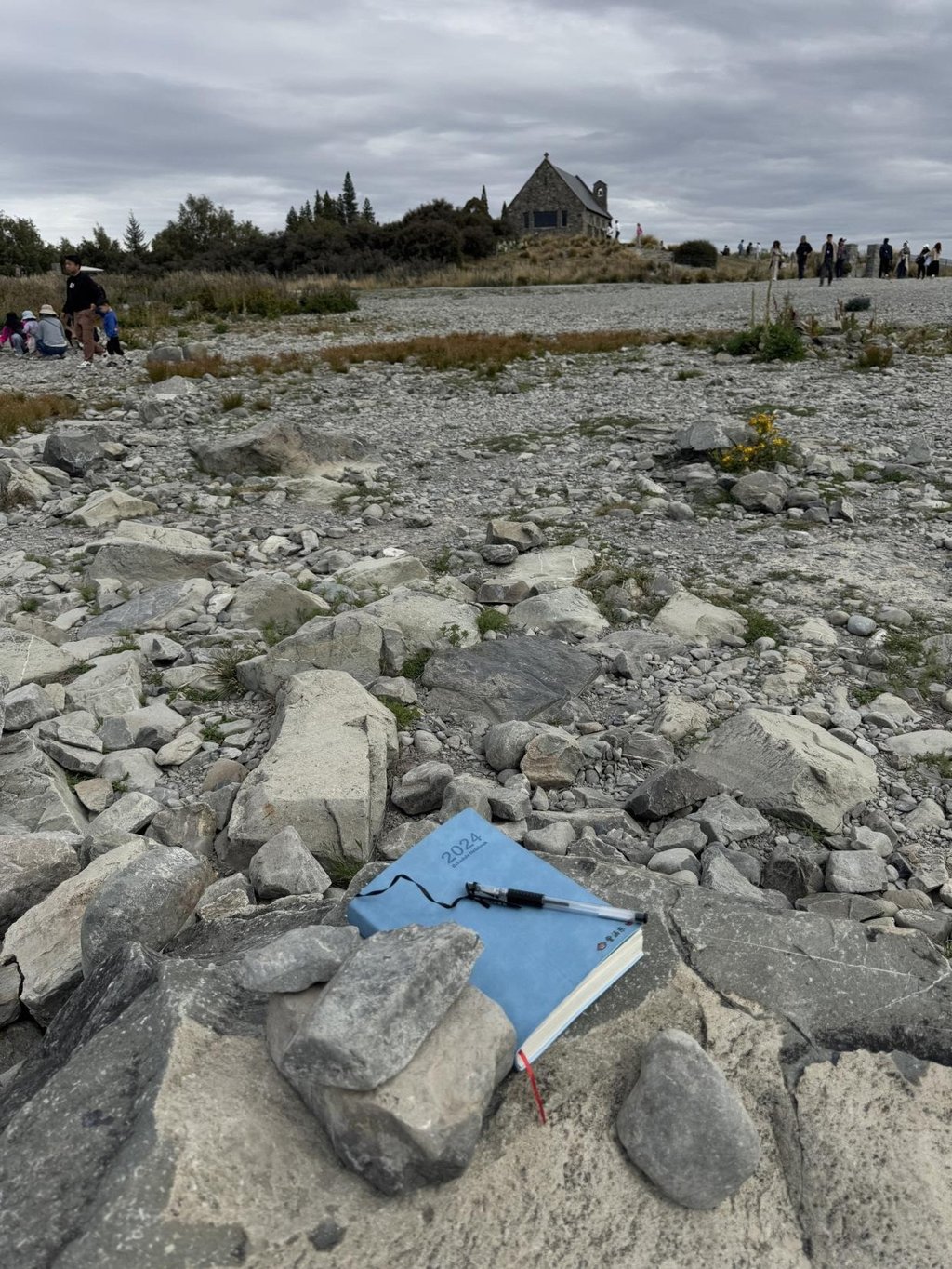 Little Zi Handong’s blue notebook and pen were thoughtfully placed under some rocks for safekeeping. Photo: Handout