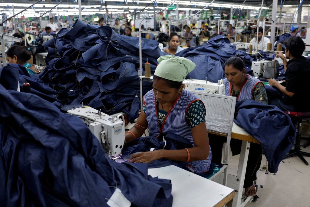 Workers stitch denim shirts in a garment manufacturing unit on the outskirts of Ahmedabad, a Tier 2 city in India, on August 5. Nearly US$10 billion of India’s textile and apparel exports ended up in the US last year, accounting for nearly 30 per cent of the industry’s total trade. Photo: Reuters