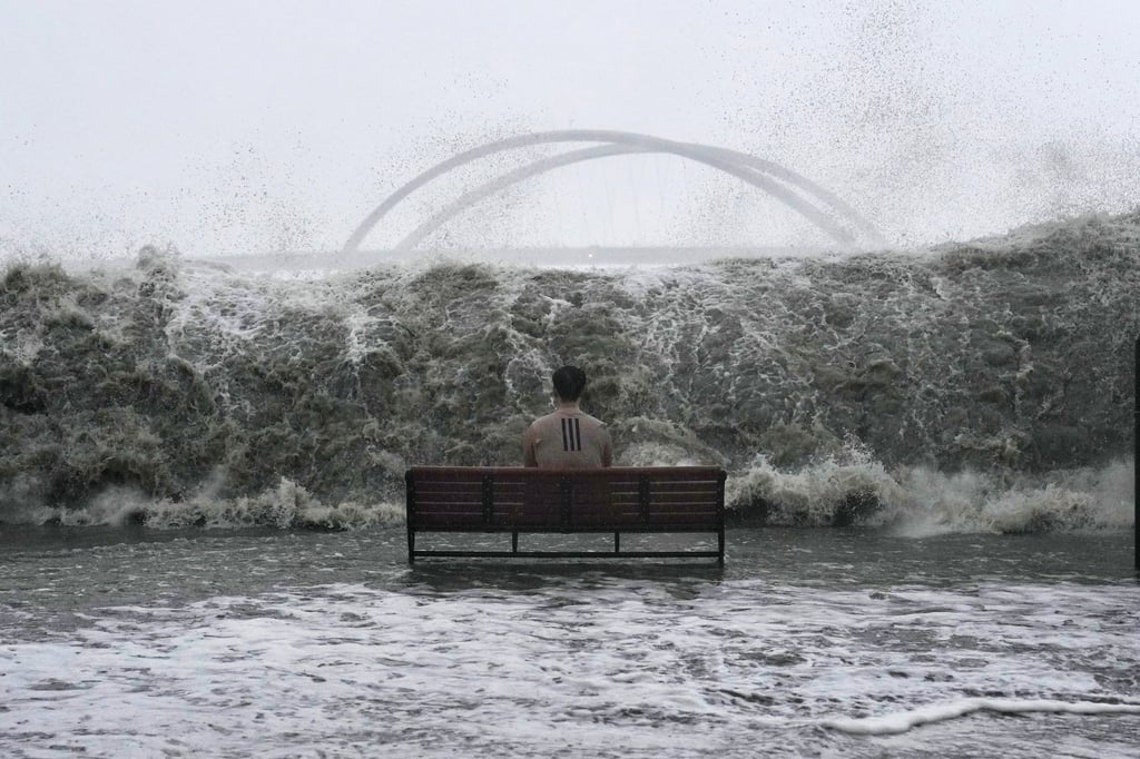 A man sits on a bench on the Tseung Kwan O promenade as waves approach during Super Typhoon Ragasa, on September 24, 2025. Photo: Elson Li