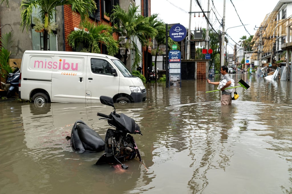 A man stands in floodwater after heavy rain hit Canggu in Badung regency, Bali, Indonesia, on September 15. Photo: Xinhua A man stands in floodwater after heavy rain hit Canggu in Badung regency, Bali, Indonesia, on September 15. Photo: Xinhua