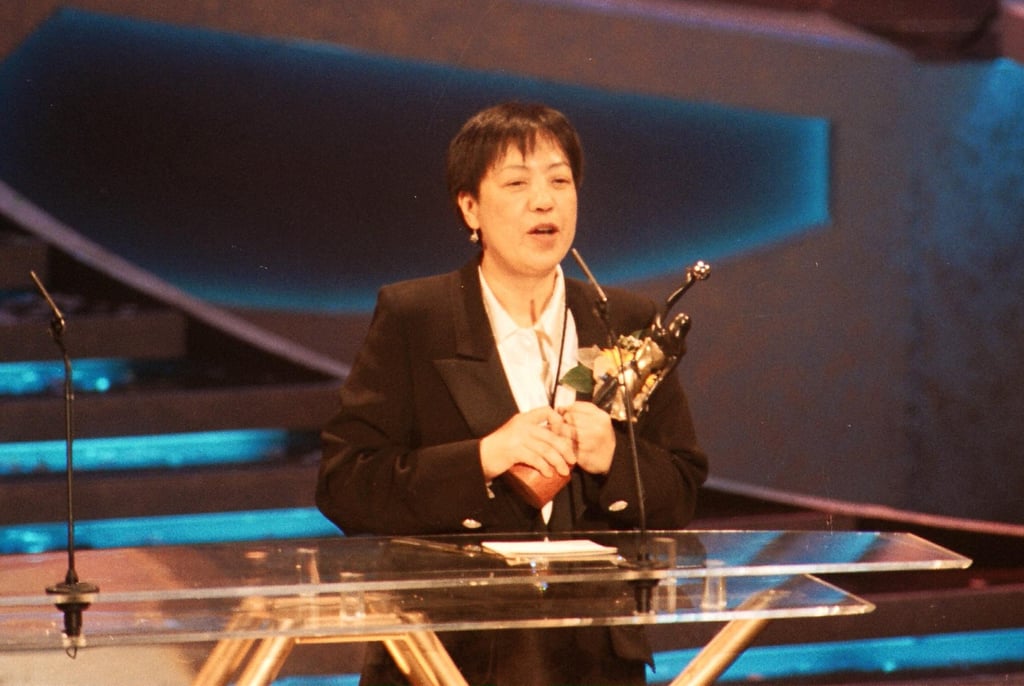 Ann Hui receives her best director award at the 15th Hong Kong Film Awards in 1996. Photo: SCMP