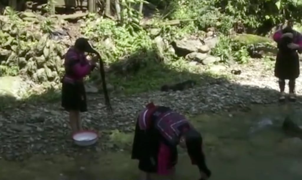 Big job: Women from the ancient ethnic group washing their hair in a river. Photo: Handout