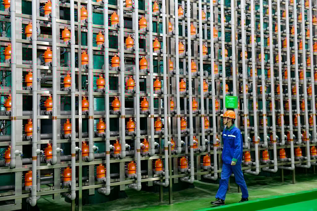 An employee checks a production line of a biotech company in eastern China’s Shandong province. Photo: Xinhua