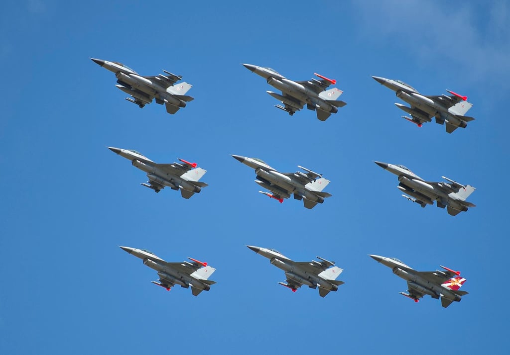 Danish F-16 fighters fly during an air show at Karup Air Field in Denmark. The Karup military base houses the armed forces’ helicopters, airspace surveillance, flight school and support functions. Photo: Reuters