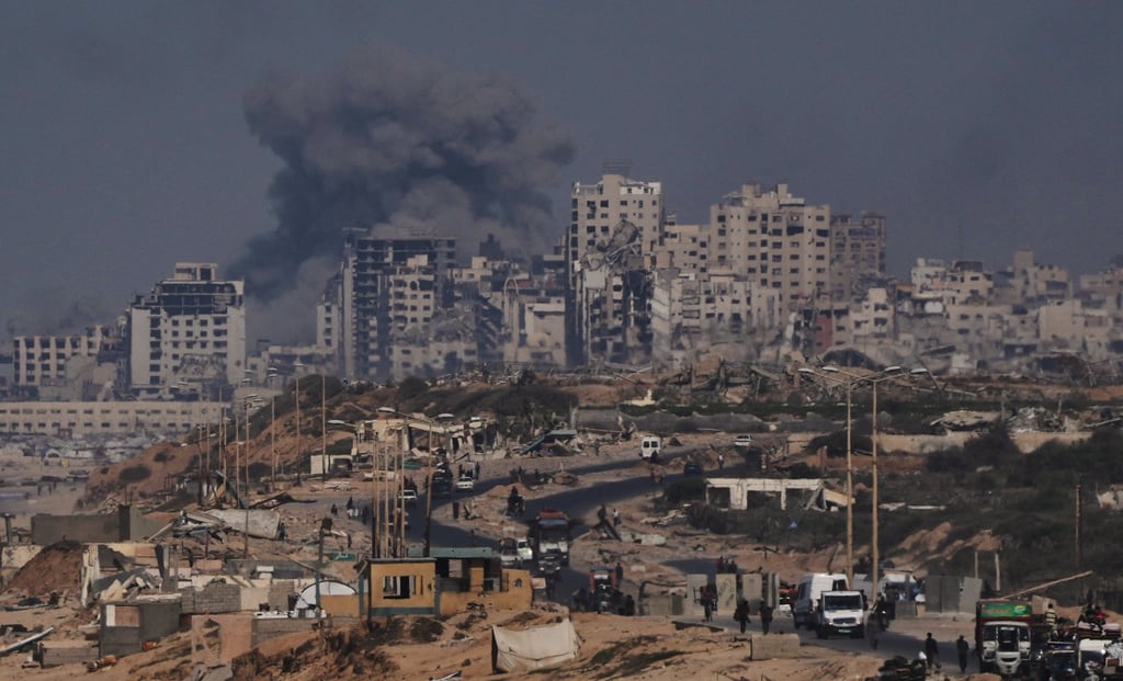 Smoke rises following an Israeli military strike in Gaza City on Friday. Photo: AP Smoke rises following an Israeli military strike in Gaza City on Friday. Photo: AP