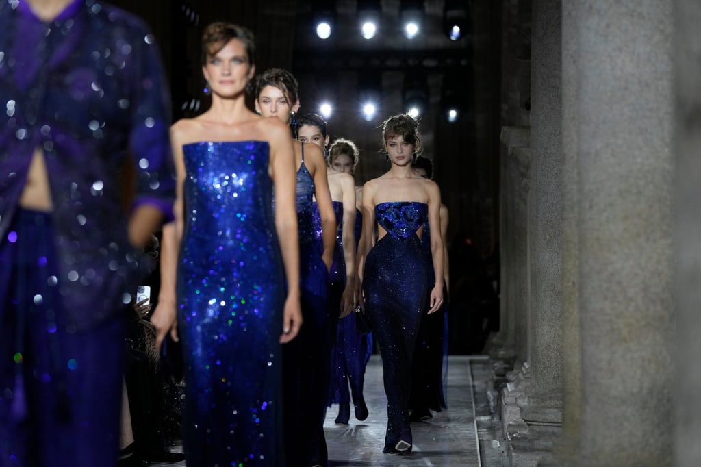 The blue evening gowns that closed the Armani show were inspired by the deep hues of the Mediterranean Sea. Photo: AP