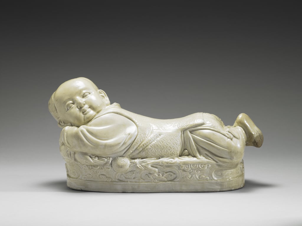 A porcelain pillow in the shape of a recumbent child from the 12th century. Photo: Handout