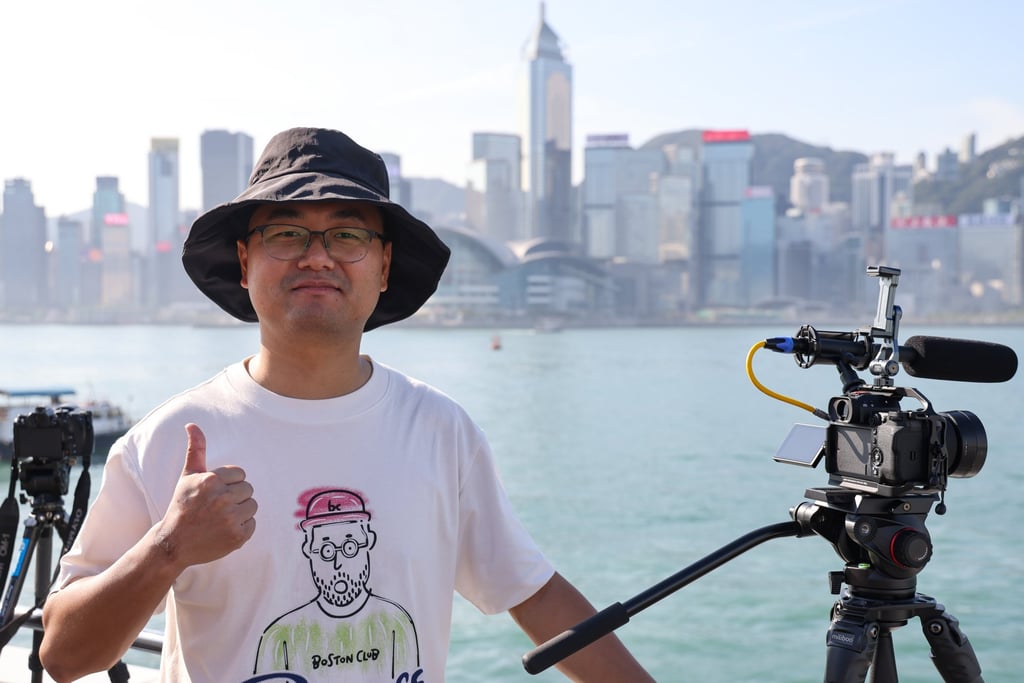 Victor Wu, a 30-year-old military hardware enthusiast from Zhuhai, is among dozens of people waiting to catch a glimpse of the two PLA ships at Tsim Sha Tsui’s waterfront. Photo: Jelly Tse