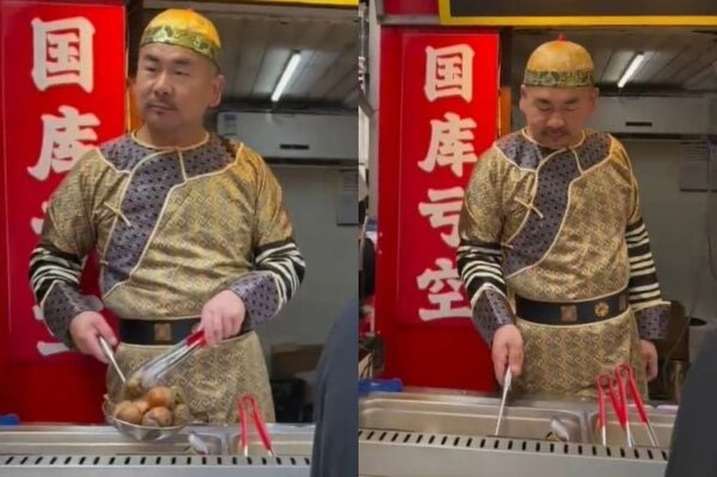 Ye hams it up in his emperor’s robe and cap. The outfit has helped his business boom. Photo: Handout Ye hams it up in his emperor’s robe and cap. The outfit has helped his business boom. Photo: Handout