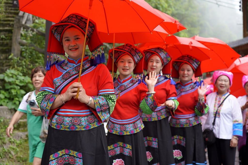During the Shuyang Festival, the Zhuang ethnic group showcases runway presentations in the terraced fields of Longsheng Various Nationalities autonomous county in Guangxi Zhuang autonomous region, China. Photo: Wei Jiyang/VCG via Getty Images