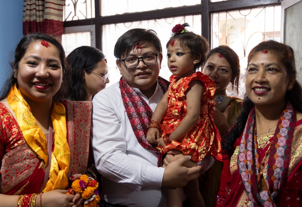 Nepal’s newly appointed Living Goddess, Aryatara Shakya, looks on in her private home. The Living Goddess is a young pre-pubescent girl considered an incarnation of the Hindu Goddess of Power, Kali. Photo: EPA
