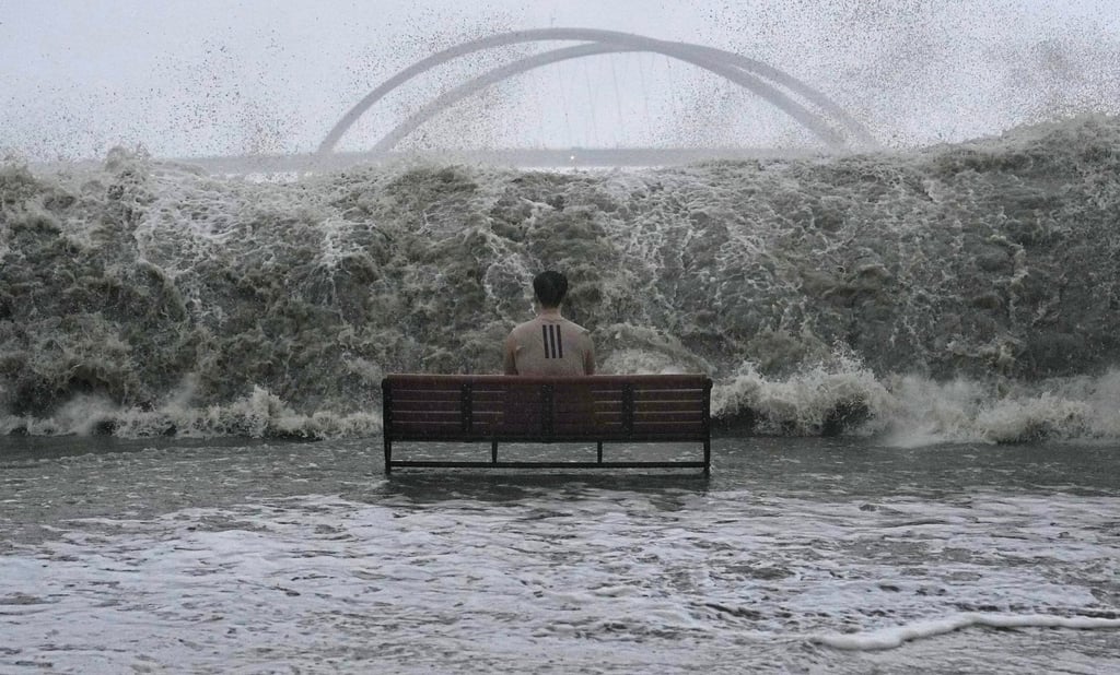 A man sits on a bench on the Tseung Kwan O promenade as waves approach during Super Typhoon Ragasa on September 24. Photo: Elson Li