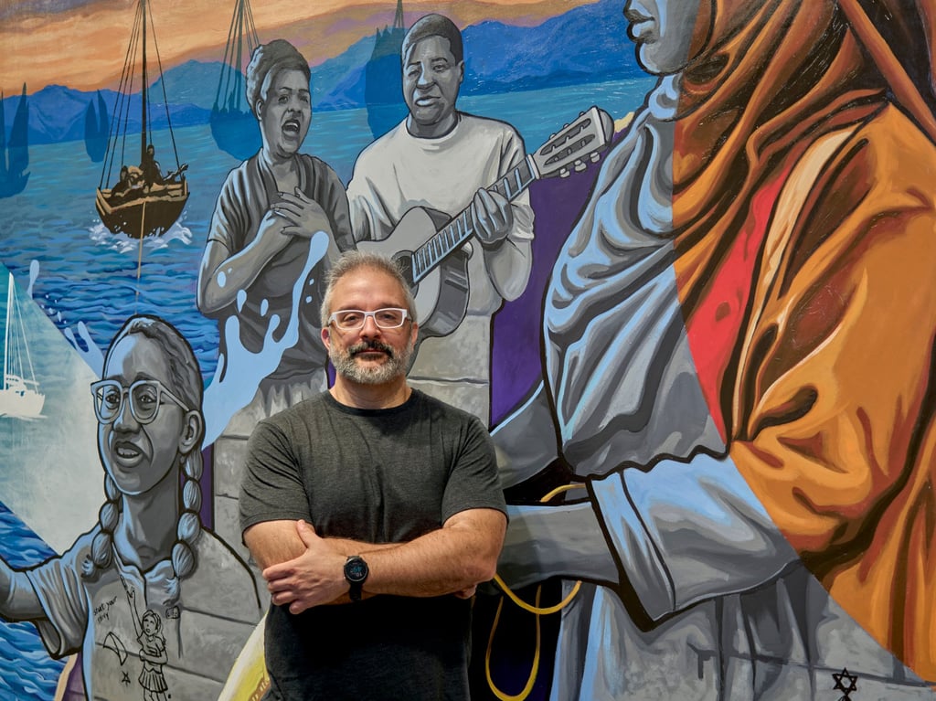 Eric Okdeh, with his mural Resilience, at Tai Kwun Photo: courtesy Tai Kwun Eric Okdeh, with his mural Resilience, at Tai Kwun Photo: courtesy Tai Kwun
