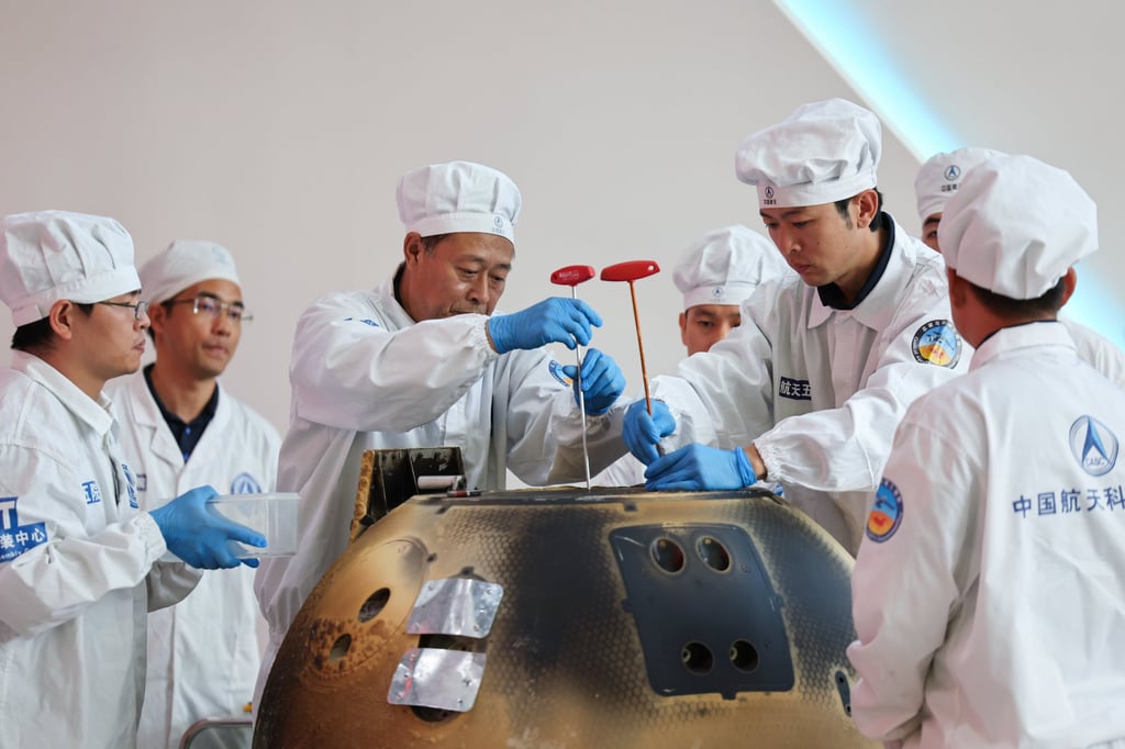 The returner of the Chang’e-6 lunar probe is opened during a ceremony at the China Academy of Space Technology in Beijing on June 26, 2024. Photo: Xinhua