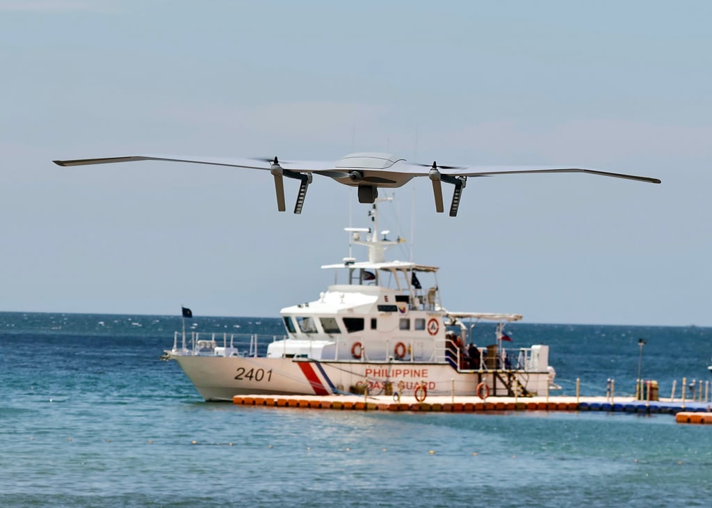 A drone hovers above a Philippine Coast Guard patrol vessel in Bataan province in April. Photo: EPA-EFE