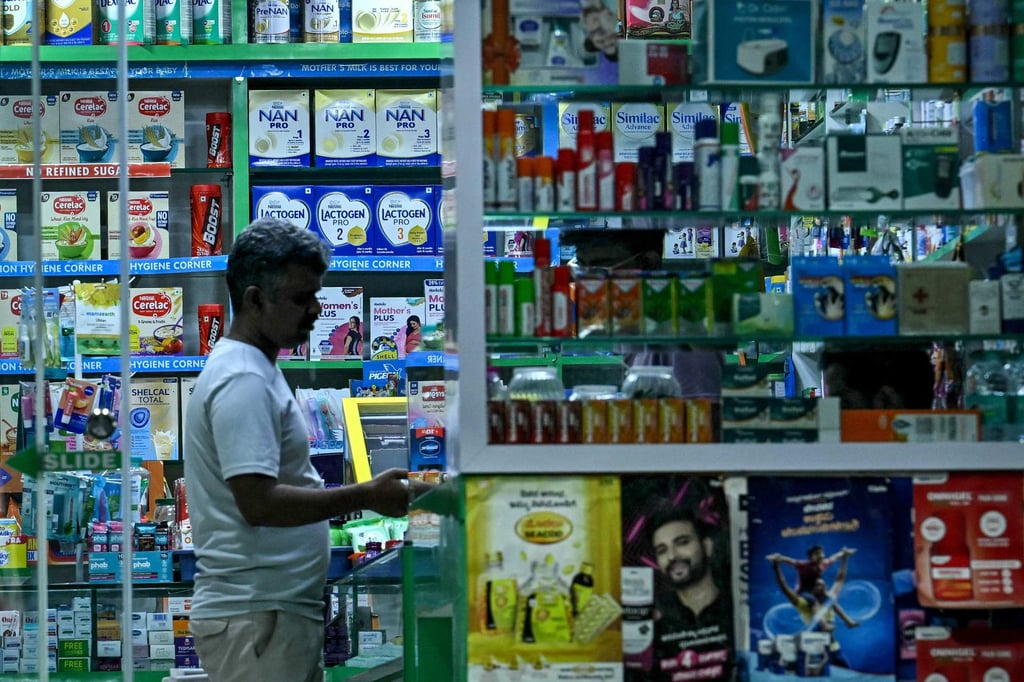 A man buys medicines from a pharmacy in Bengaluru, India, on September 22. Photo: AFP
